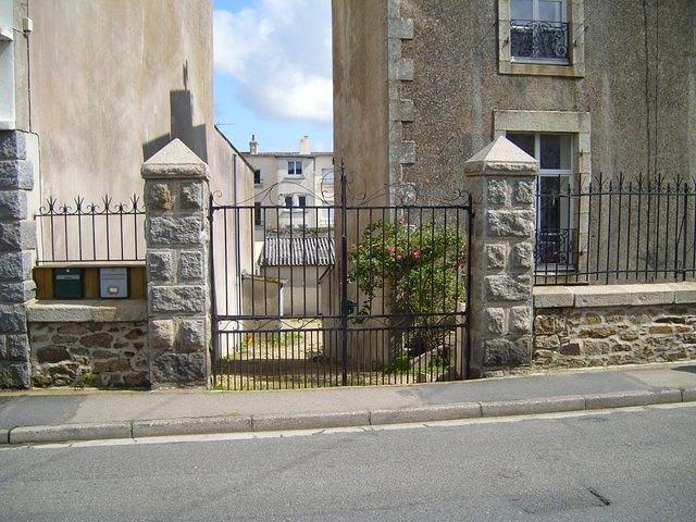 metal gate with stone posts
