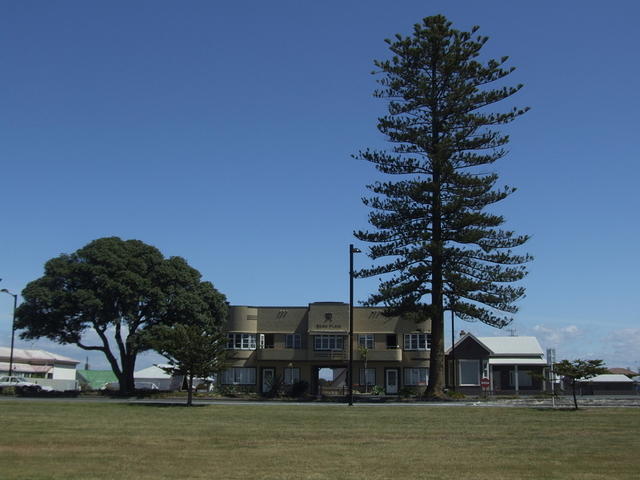 Art Deco flats with Norfolk Pine, Napier, New Zealand