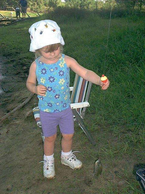 Little girl caught a fish