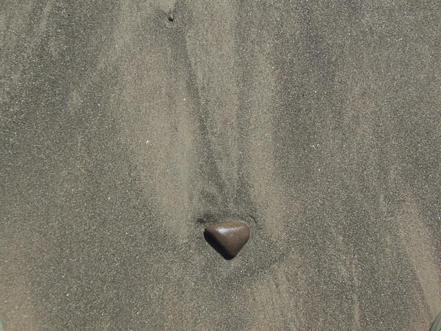 Sand on beach with stone