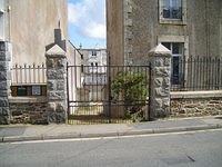 metal gate with stone posts