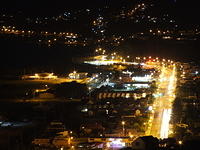 nighttime view of freeway and city lights