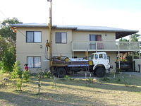 Water bore lined up to drill in a front yard, Wanneroo, Western Australia.