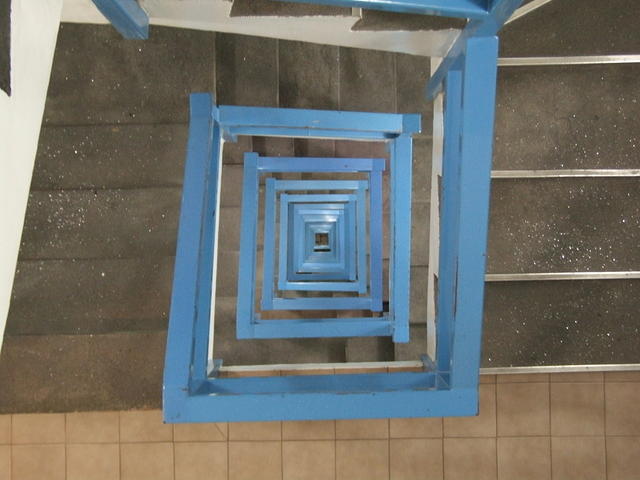 Stairwell with blue railing