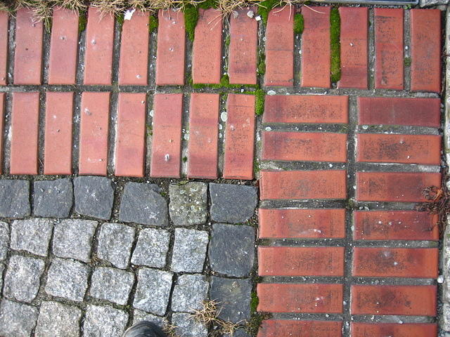 Paving stone and red bricks corner