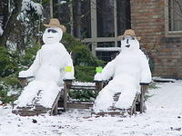 Snowmen in lawn chairs