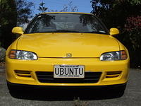 yellow car with ubuntu vanity license plate
