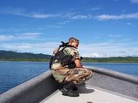soldier in front of boat
